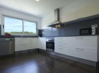 A kitchen or kitchenette at Villa Mont Rodó con piscina y jardín privado - Pet Friendly
