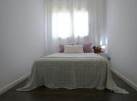 A bed or beds in a room at Villa Mont Rodó con piscina y jardín privado - Pet Friendly