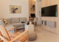 Televízia a/alebo spoločenská miestnosť v ubytovaní Charitos Heights Boutique Apt II, Kolonaki