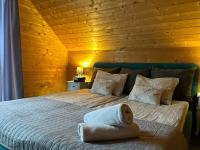 Posteľ alebo postele v izbe v ubytovaní Resort EDEN domki, apartamenty i pokoje
