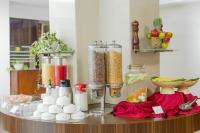 a counter with many containers of food and other ingredients at Monarch Luxur - Infantry Road in Bengaluru