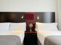 Postel nebo postele na pokoji v ubytování SM Hotel Sant Antoni
