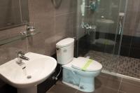 a bathroom with a toilet and a sink and a shower at EZE Homestay in Ji&#39;an