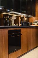 a kitchen with a sink and a black dishwasher at Le Grand Galop - Duplex in Deauville