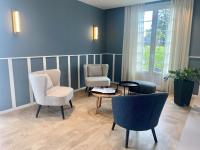 a living room with two chairs and a table at Quality Hotel La Marebaudière Vannes Centre in Vannes