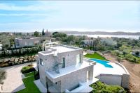 an aerial view of a house with a swimming pool at Villa Tranquility - Walk to the Beach with Infinity Pool in Porto Heli