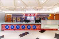 a restaurant with a counter with signs on it at 柜富賓王旅店-台北館 Giant Rich King Plaza Hotel in Taipei