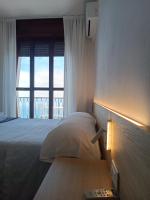A bed or beds in a room at Hotel Due Gemelli