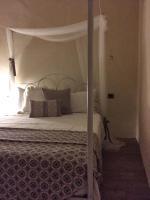 A bed or beds in a room at Ai due Mori Apt by Addler House Ospitality