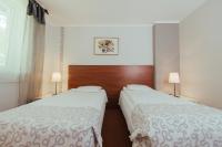 Posteľ alebo postele v izbe v ubytovaní Hotel Pod Sosnami
