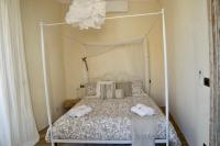 A bed or beds in a room at Ai due Mori Apt by Addler House Ospitality