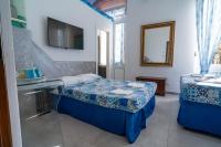 Posteľ alebo postele v izbe v ubytovaní Teresa Rooms & Suites