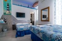 Posteľ alebo postele v izbe v ubytovaní Teresa Rooms & Suites