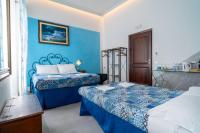 Posteľ alebo postele v izbe v ubytovaní Teresa Rooms & Suites
