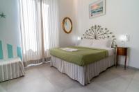 Posteľ alebo postele v izbe v ubytovaní Teresa Rooms & Suites