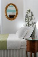 Posteľ alebo postele v izbe v ubytovaní Teresa Rooms & Suites