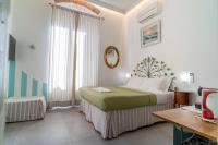 Posteľ alebo postele v izbe v ubytovaní Teresa Rooms & Suites