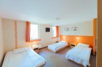 Posteľ alebo postele v izbe v ubytovaní Hotel Pod Sosnami