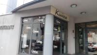 a store front with signs on the windows at Modern & Elegant City Center Apartments in Plovdiv