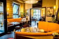 a dining room with tables and chairs in a restaurant at Hotel Hohenstaufen in Koblenz