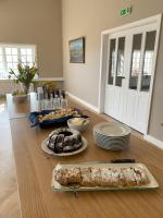 a table with plates of food on top of it at Hotel Stafholt in Varmaland