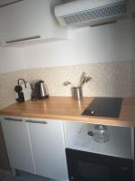 a kitchen with a wooden counter top with a sink at Maisonette avec jardinet sur le bas du Faron in Toulon