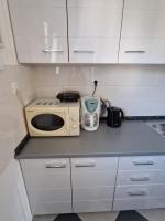 Kuchyňa alebo kuchynka v ubytovaní APARTMAN J&M
