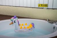 a toy elephant in a bath tub with ducks in it at Ashare Hotel in Jiaoxi