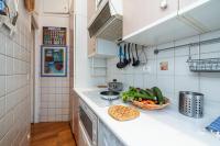 a kitchen with a counter top with a bowl of vegetables at Regina - Happy Rentals in Menton