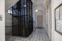 a hallway with a spiral staircase in a building at Regina - Happy Rentals in Menton