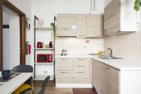A kitchen or kitchenette at URBANA 37 Maison