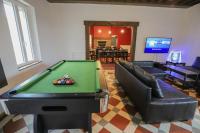a living room with a pool table and couches at Crazy Villa Champs Corons 61 - Interior heated pool - 2h from Paris - 30p in Les Menus