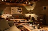 a living room with a couch and a table at Zannier Hotels Le Chalet in Megève