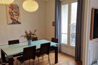 a dining room with a blue table and chairs at Magnifique appartement de charme au cœur de Paris in Paris