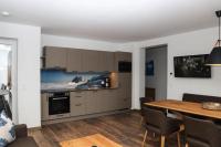 A kitchen or kitchenette at Apartment in Bramberg am Wildkogel with barbecue
