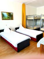 Posteľ alebo postele v izbe v ubytovaní Hostel Omega