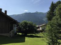 a view of a house with a mountain in the background at Large 8 Bed Apartment. Perfect Location. in Stuhlfelden