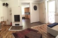 a living room with a couch and a flat screen tv at Large 8 Bed Apartment. Perfect Location. in Stuhlfelden
