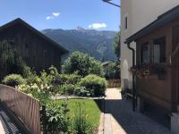 a backyard with a garden and a house with a fence at Large 8 Bed Apartment. Perfect Location. in Stuhlfelden