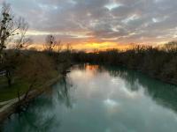 a view of a river at sunset at Studio Les Oliviers in Noisy-le-Grand