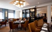 a restaurant with tables and chairs and a chandelier at The Gainsborough Bath Spa - Small Luxury Hotels of the World in Bath