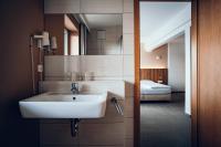 A bed or beds in a room at Pension Baumgartner-Berghof