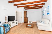 A television and/or entertainment centre at Casa Bruna - Binibeca Nou