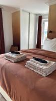 two towels are sitting on top of a bed at Amazing view on the Versailles Palace - Paris 15min in Versailles