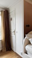 a bedroom with a white door and a window at Amazing view on the Versailles Palace - Paris 15min in Versailles