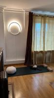 a room with a yoga mat in front of a window at Amazing view on the Versailles Palace - Paris 15min in Versailles