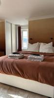 a bedroom with a large bed with a window at Amazing view on the Versailles Palace - Paris 15min in Versailles