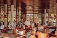 a living room with couches and tables and windows at Lily of the Valley in La Croix-Valmer