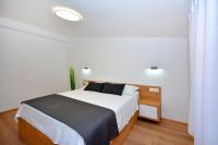 Postel nebo postele na pokoji v ubytování Apartments Radeljić