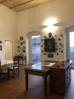 a living room with a table and some plates on the wall at Resort Nuvola Srls in Ripabottoni
